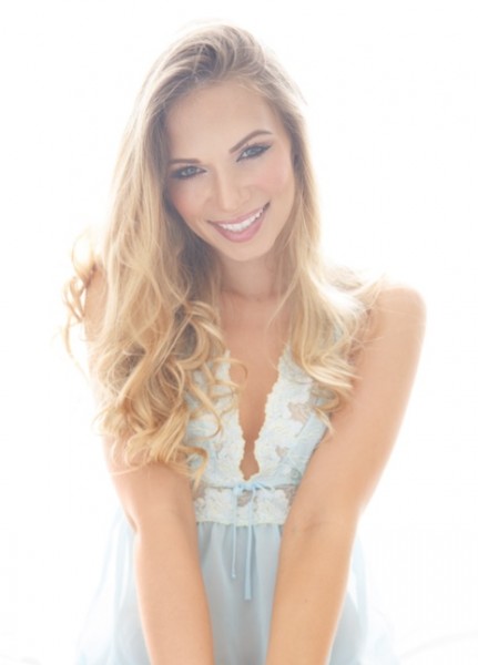 light_blue_smiling_headshot_Chelsea_Dawn